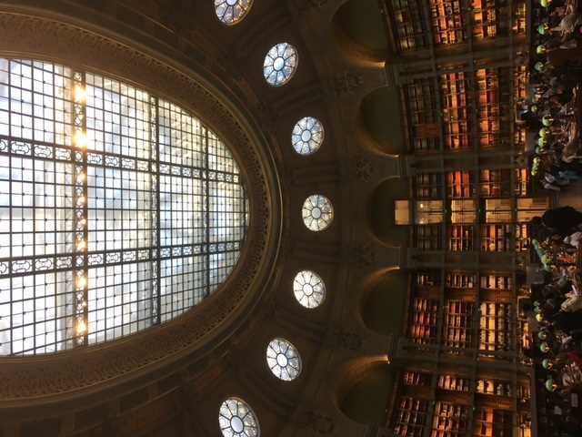 Photo of a large circular shaped library with a glass ceiling roof