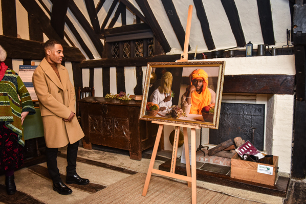 man admiring a piece of art on the gallery