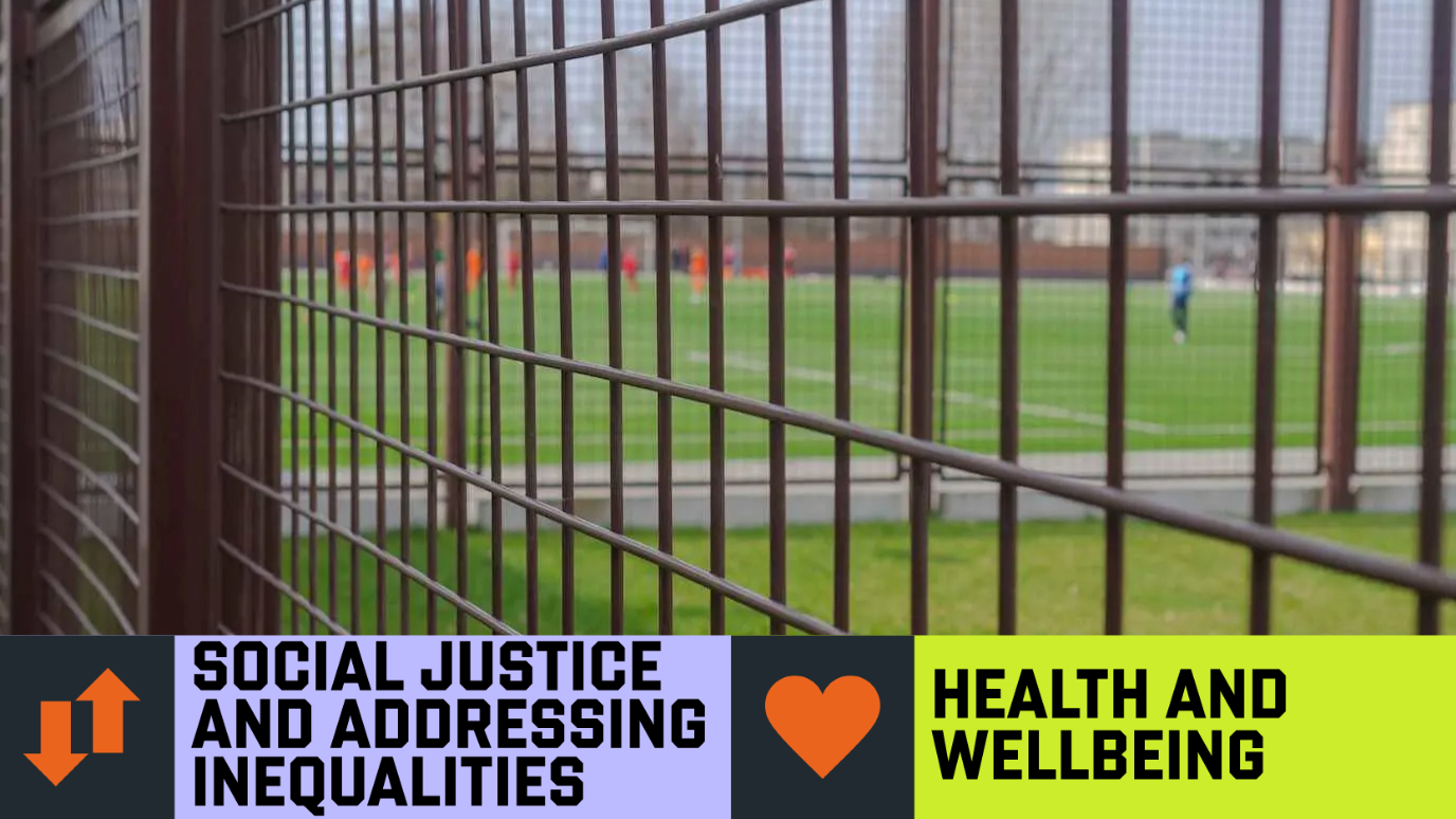 close up metal grille fence with obscured figures playing sports in background - ‘Social Justice and Addressing Inequalities’ and ‘Health and Wellbeing’ Research strength graphic banner